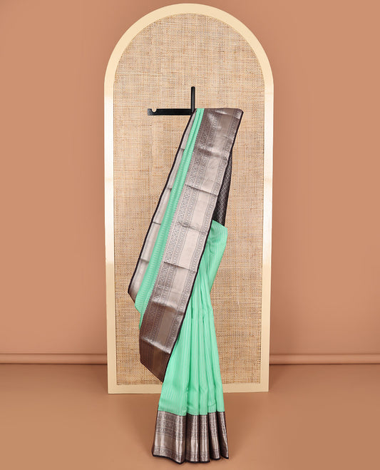 Mint green sriped vasundhara elite silk saree with contrast intricate zari design border & floral jaal design pallu