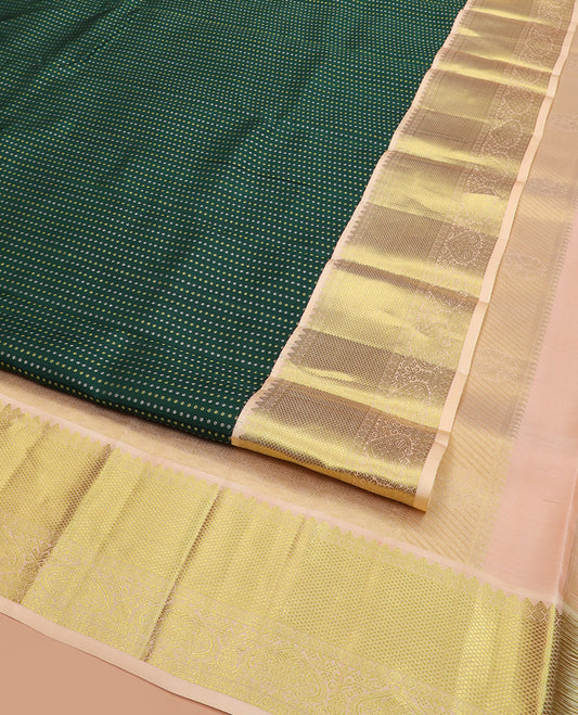 Green Vasundhara Lite Silk Mix Saree, Richly Detailed with Zari Buttas All Over Its Body, Complemented by Contrast Border of Rekku, Rudraksham, and Kuyil Kann Designs, Grandly Woven Pallu of Jaal Designs, and Paired with a Contrast Blouse