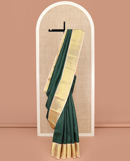 Green Vasundhara Lite Silk Mix Saree, Richly Detailed with Zari Buttas All Over Its Body, Complemented by Contrast Border of Rekku, Rudraksham, and Kuyil Kann Designs, Grandly Woven Pallu of Jaal Designs, and Paired with a Contrast Blouse