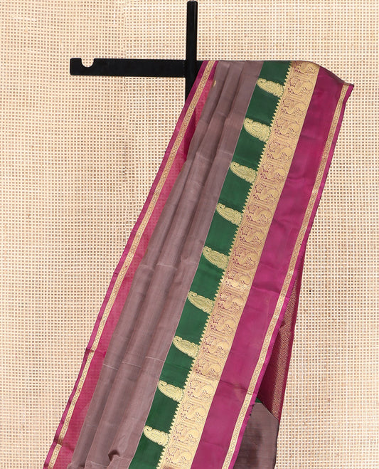 Brown Vasundhara Lite Silk Mix Saree, Graced with Zari Buttas All Over Its Body, Complemented by a Contrast Rettai Pettu Border of Manga, Rekku, Mayil, and Kamalam Designs, Grandly Woven Pallu, and Paired with a Contrast Blouse