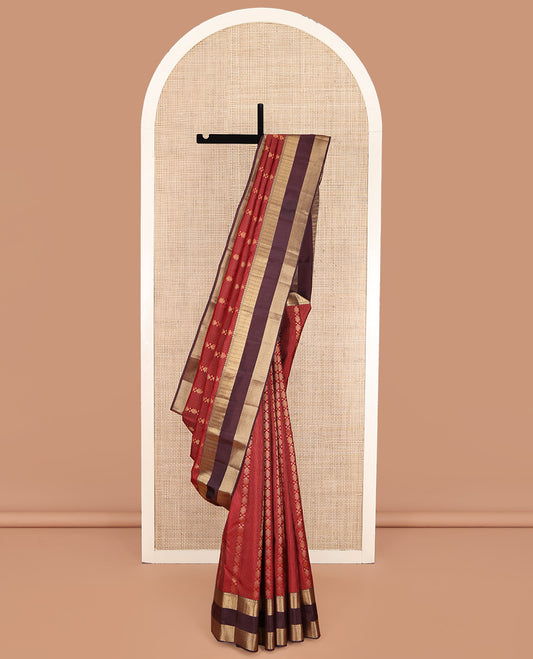 Rust Vasundhara Lite Silk Mix Saree, Bedecked with Zari Buttas and Stripes on Its Body, Complemented by a Contrast Rettai Pettu Border of Thilakam, Neli, and Paiyaadi Kattam Designs, Grandly Designed Pallu, and Paired with a Contrast Blouse