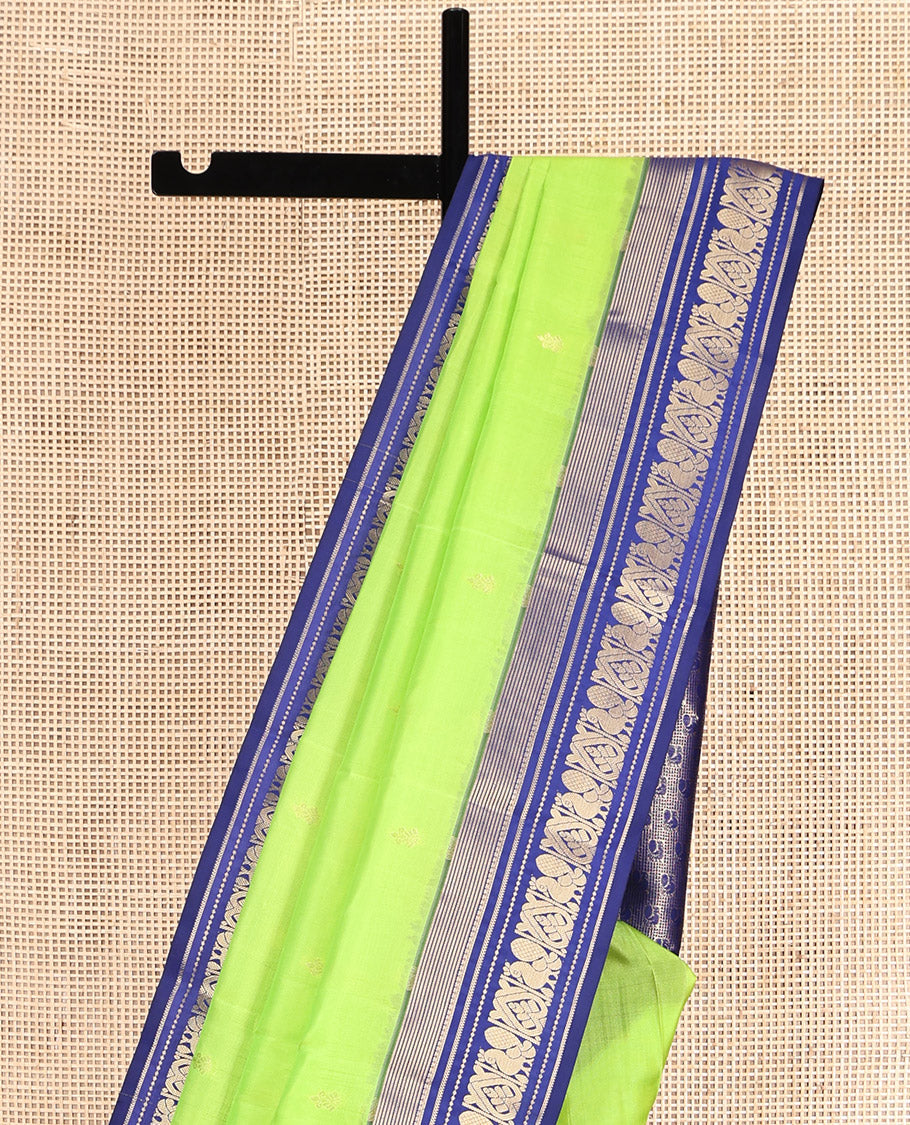 Green Vasundhara Lite Silk Mix Saree, Sparsely Sparkled with Zari Buttas, Complemented by a Contrast Zari Border of Mayil Design, Pallu of Mayil Designs, and a Contrast Blouse