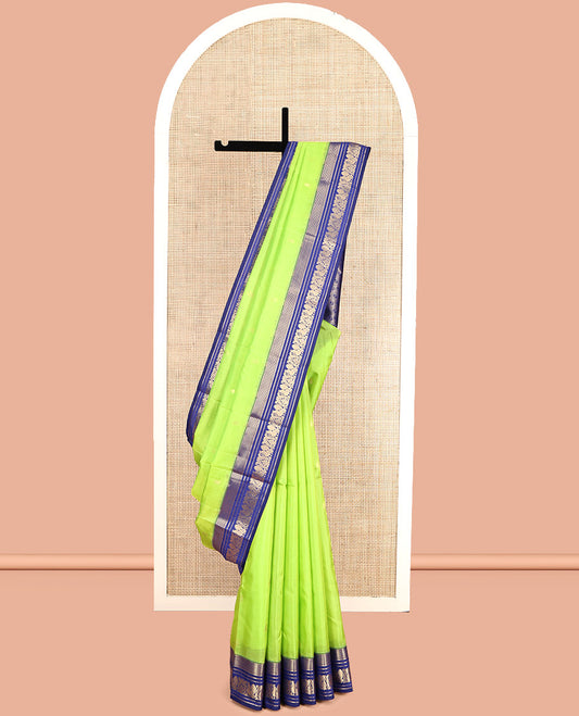 Green Vasundhara Lite Silk Mix Saree, Sparsely Sparkled with Zari Buttas, Complemented by a Contrast Zari Border of Mayil Design, Pallu of Mayil Designs, and a Contrast Blouse