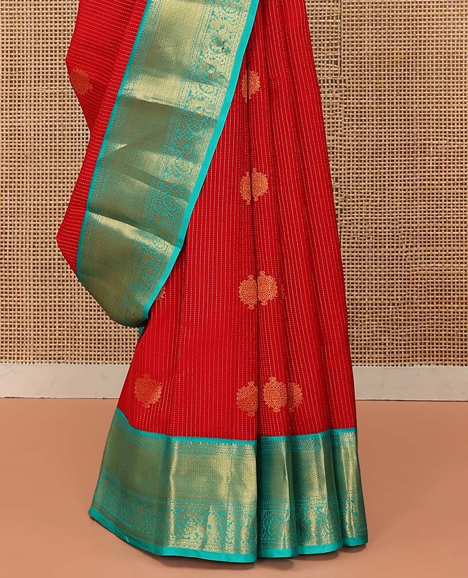 Red Vasundhara Lite Silk Mix Saree Gracefully Embellished with Zari Buttas and Stripes, Complemented with a Contrast Border Featuring Rekku, Banaras, Neli, Mayil Kann, Kodi Visiry, and Mayil Designs, Intricately Decked Up Pallu, and a Contrast Blouse