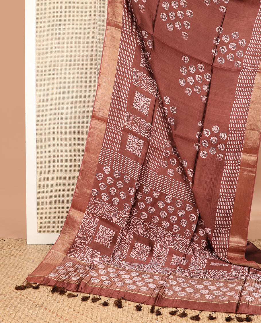 Brown floral and geometric printed banana pith saree, zari border, and printed pallu