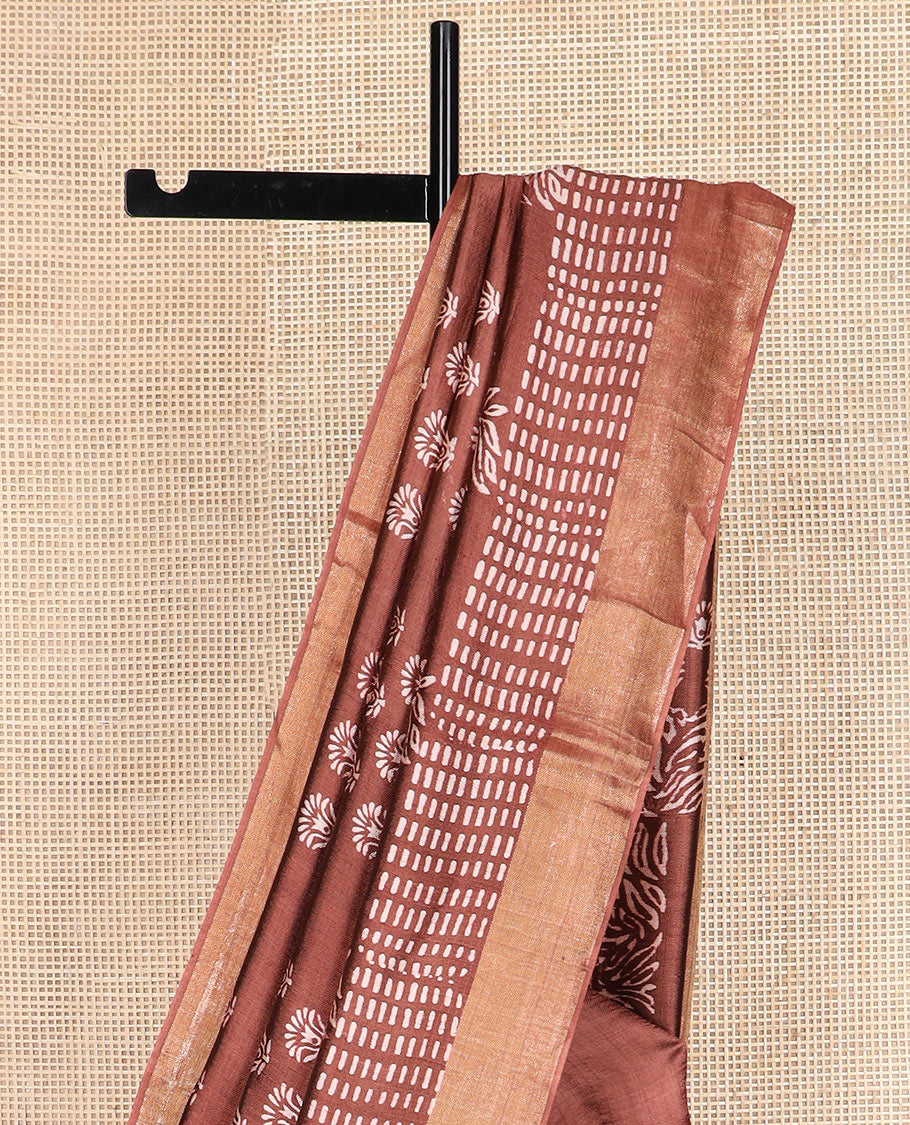Brown floral and geometric printed banana pith saree, zari border, and printed pallu