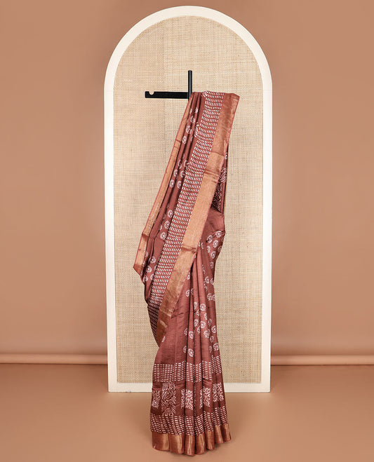 Brown floral and geometric printed banana pith saree, zari border, and printed pallu