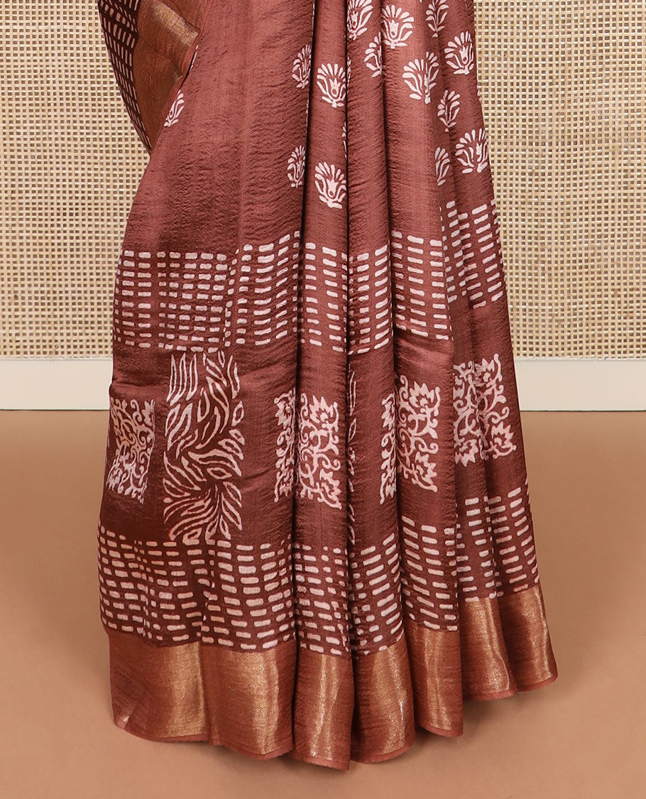 Brown floral and geometric printed banana pith saree, zari border, and printed pallu