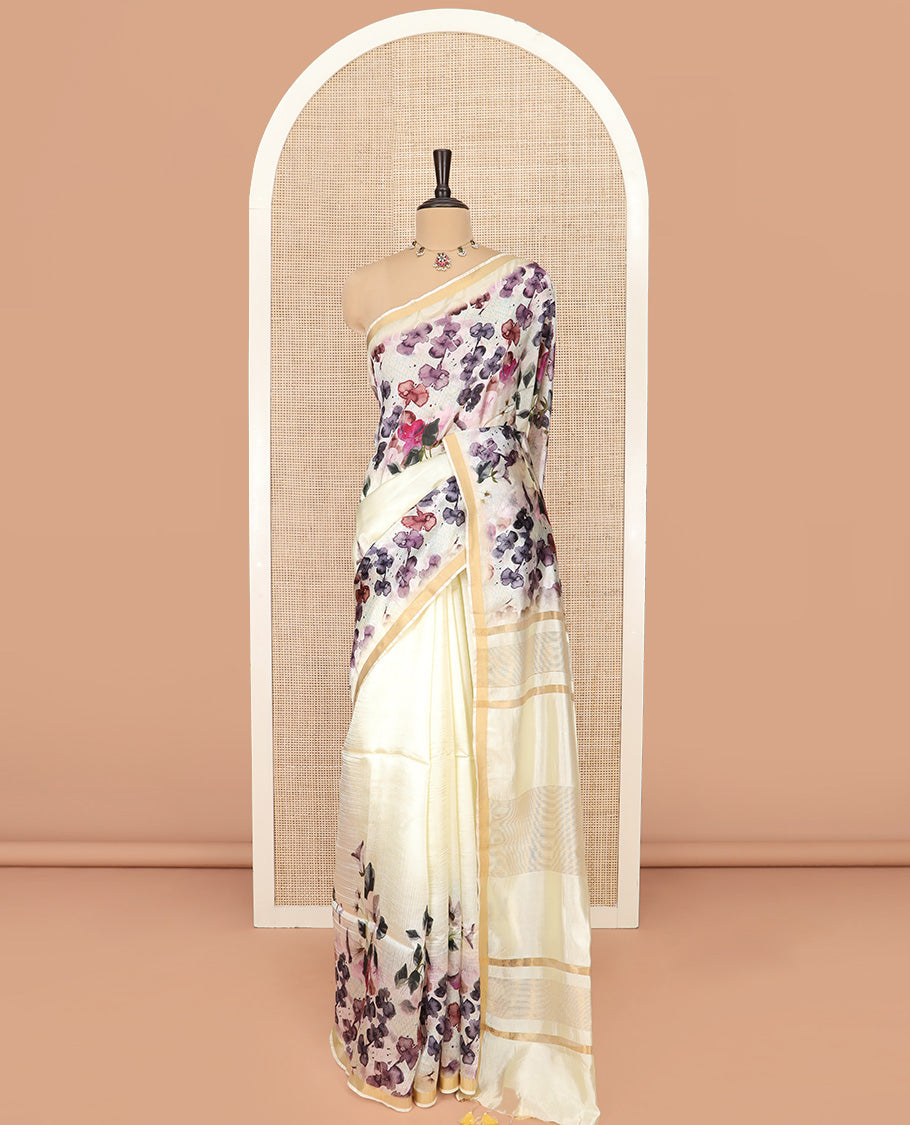 White Banana Pith Saree Mesmerized with Floral Motifs Print, Zari Bavanji Border, Subtle Pallu of Zari Stripes, and Paired with a Contrast Floral Printed Blouse