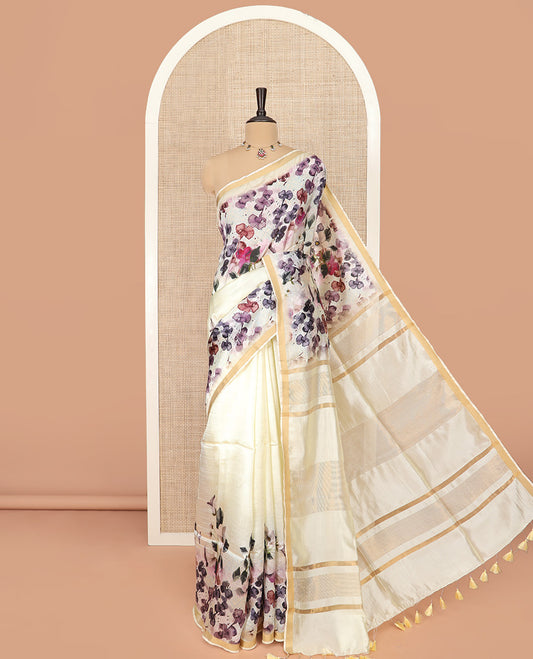 White Banana Pith Saree Mesmerized with Floral Motifs Print, Zari Bavanji Border, Subtle Pallu of Zari Stripes, and Paired with a Contrast Floral Printed Blouse