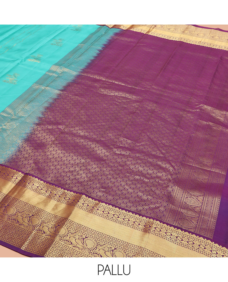 Blue Vasundhara Silk Saree Prettified with Zari Buttas, Complemented by a Contrast Blouse of Banaras, Paisa, Diamond, and Mayil Designs, Grandly Woven Pallu of Jaal Designs, and a Contrast Zari Bordered Blouse