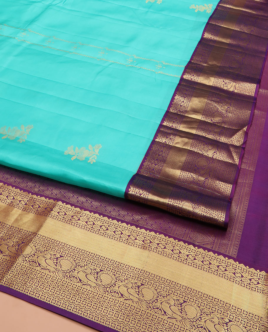 Blue Vasundhara Silk Saree Prettified with Zari Buttas, Complemented by a Contrast Blouse of Banaras, Paisa, Diamond, and Mayil Designs, Grandly Woven Pallu of Jaal Designs, and a Contrast Zari Bordered Blouse