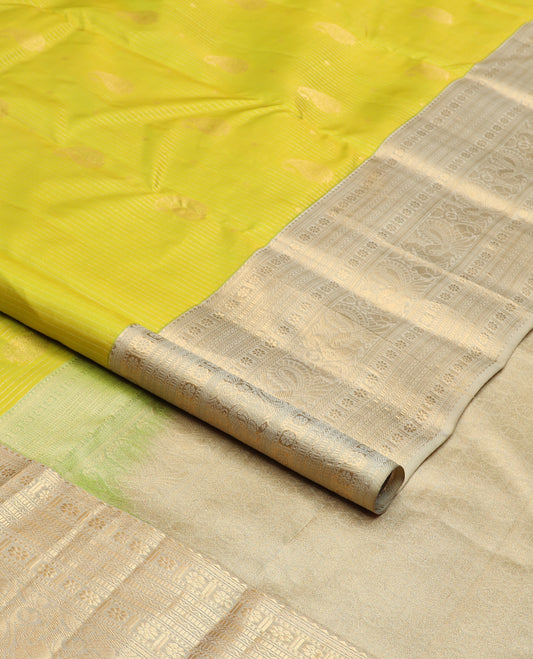 Yellow zari design silk saree, contrast border of rekku, banaras, kamalam, neli, and mayil designs, and intricate pallu