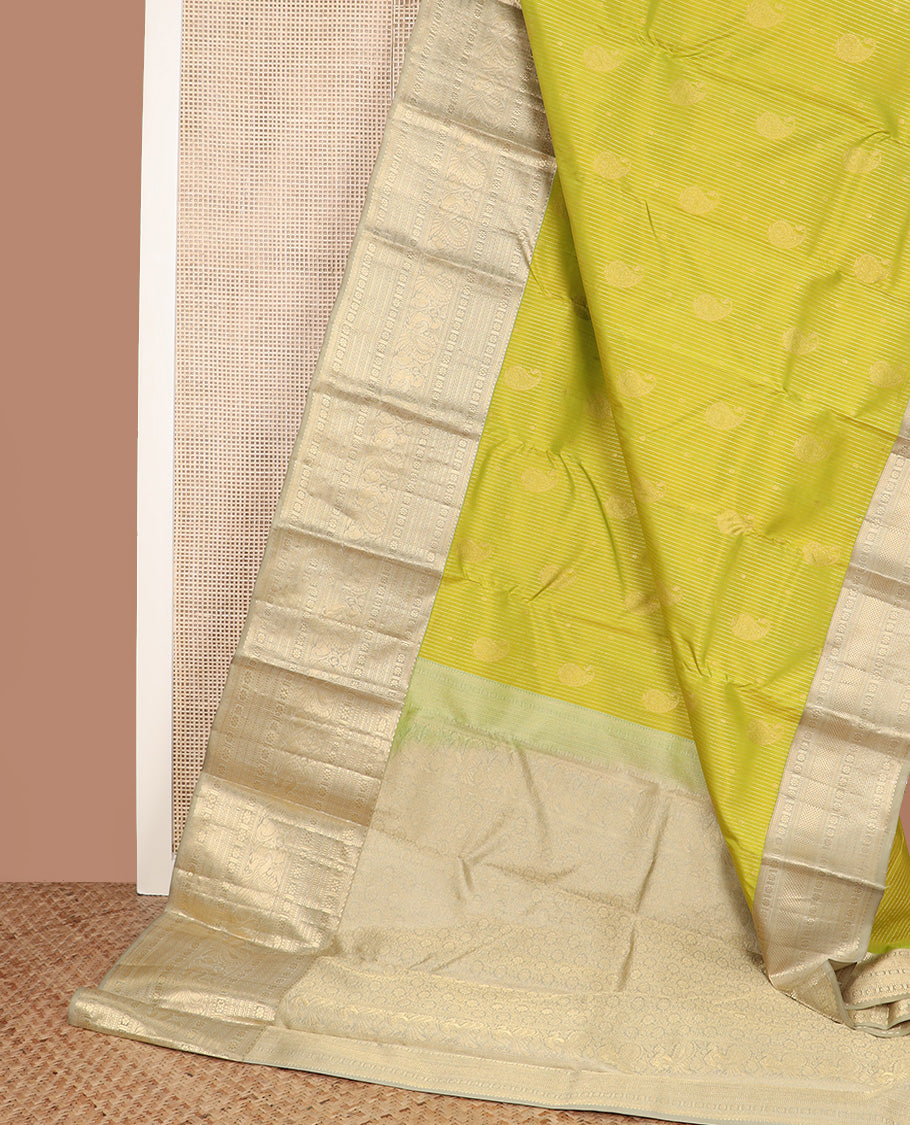 Yellow zari design silk saree, contrast border of rekku, banaras, kamalam, neli, and mayil designs, and intricate pallu