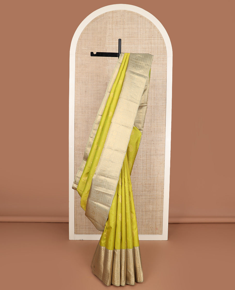 Yellow zari design silk saree, contrast border of rekku, banaras, kamalam, neli, and mayil designs, and intricate pallu