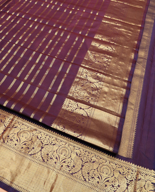Purple Vasundhara Silk Saree Detailed with Muthu, Neli, and Kathir Zari Stripes, Complemented by a Zari Border of Kathir, Mayil, and Jaal Designs, Opulently Zari Embellished Pallu, and Paired with a Matching Zari-Bordered Blouse