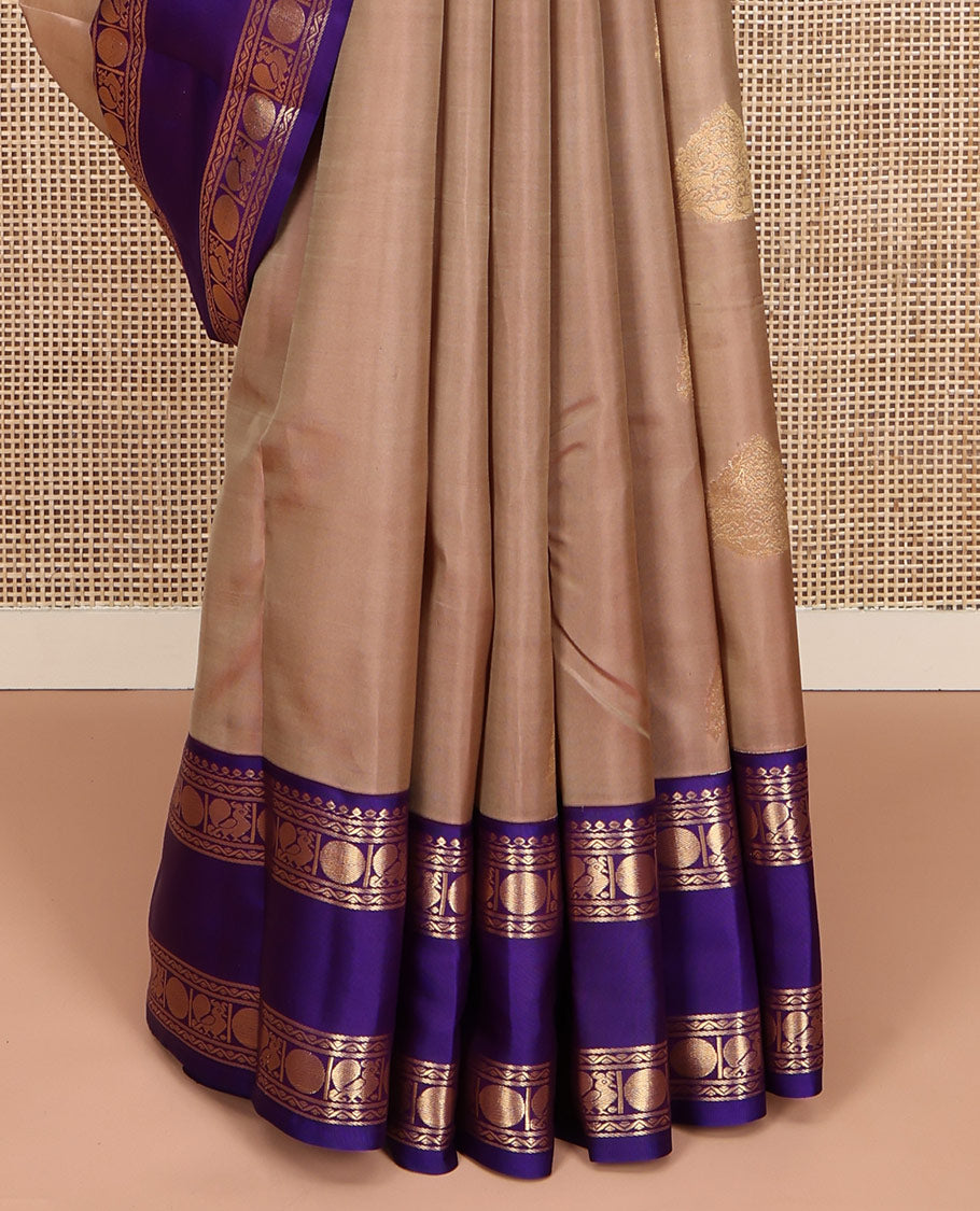 Beige Vasundhara Lite Silk Mix Saree, Accentuated With Zari Buttas All Over Its Body, Complemented by Contrast Rettai Pettu Border of Salngai, Neli, Poun and Mayil Designs, Gleaming Zari Pallu, and Paired with a Contrast Blouse