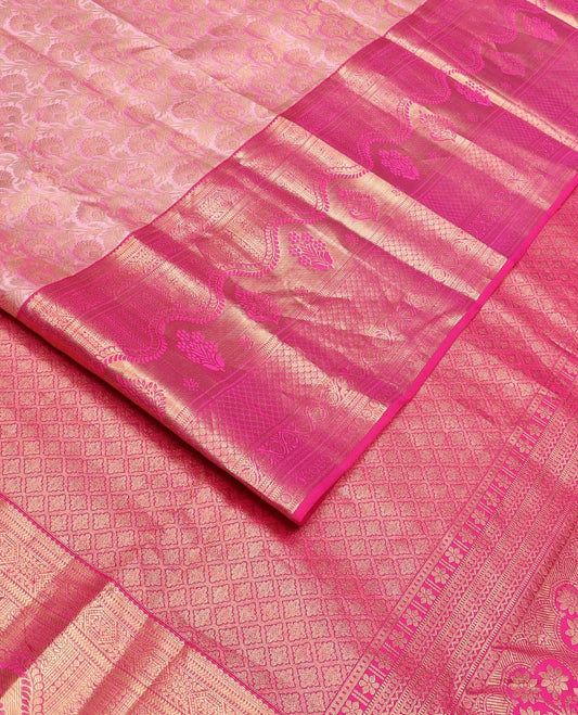 Pink floral jaal jacquard Kanchipuram wedding silk saree, contrast border steeped with traditional zari designs, and zari-rich jaal pallu