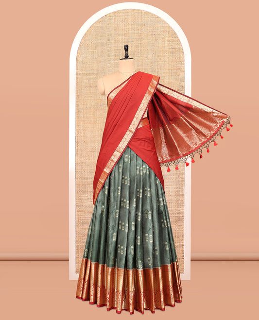 Green Art Silk Material Half Saree Set Featuring a Zari Buttas and Checked Skirt, a Contrast Traditional Zari Design Border, Contrast Blouse, and Zari Designs Dhavani