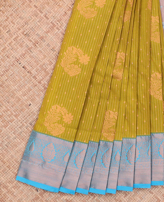 Green Budget Silk Saree Features Zari Buttas and Zari Stripes, a Hazyliy Zari Woven Contrasting Traditional Zari Border, a Zari-Decked-Up Pallu, and a Contrasting Zari-Bordered Blouse