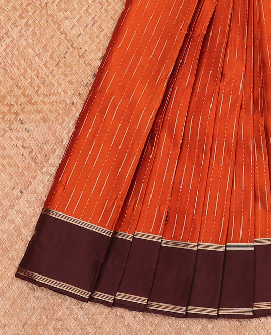 Rust Orange Budget Silk Saree Graced with Raindrop Buttas, Featuring a Simple Contrast Zari Striped Border, Enriched with an Intricately Designed Pallu, and Paired with a Contrast Subtle Blouse