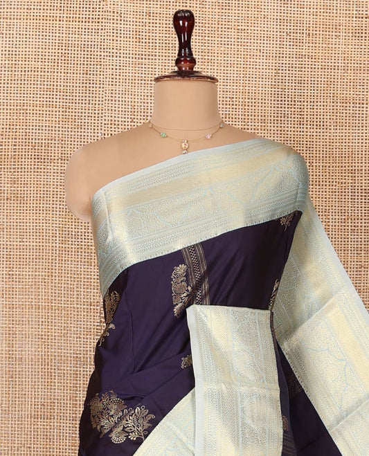 Navy Blue Budget Silk Saree, Embellished with Zari Buttas All Over Its Body, Complemented by a Contrast Traditional Zari Designs Woven Border, Pallu of Intricate Designs, and Paired with a Contrast Blouse