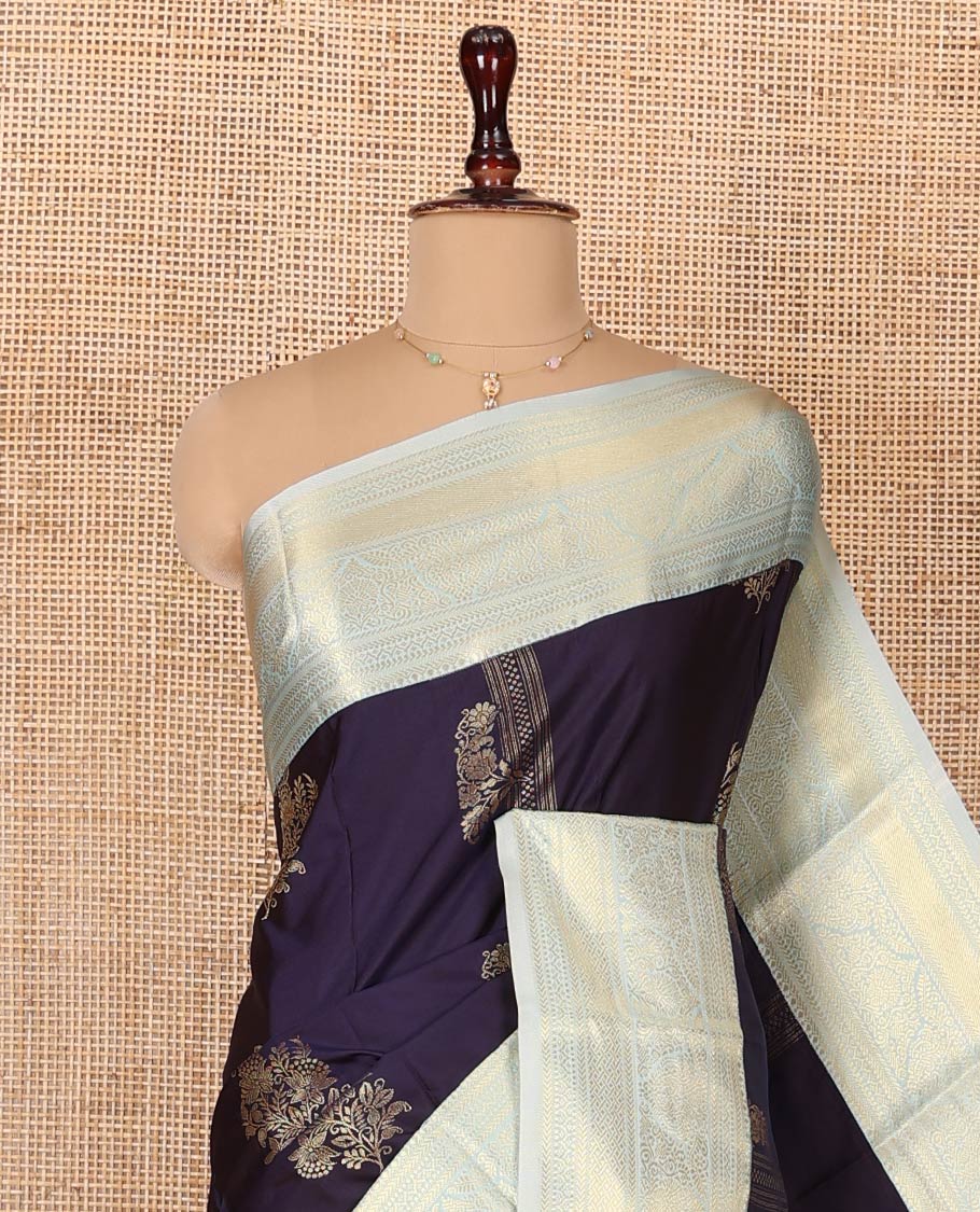 Navy Blue Budget Silk Saree, Embellished with Zari Buttas All Over Its Body, Complemented by a Contrast Traditional Zari Designs Woven Border, Pallu of Intricate Designs, and Paired with a Contrast Blouse