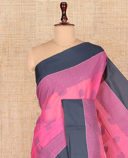 Pink Semi-Silk Cotton Saree, Sparsely Woven with Buttas and Floral-Paisley Design All Over Its Body, Complemented by Contrast Border, Sparsely Woven Pallu of Jaal Designs, and Paired with a Matching Blouse