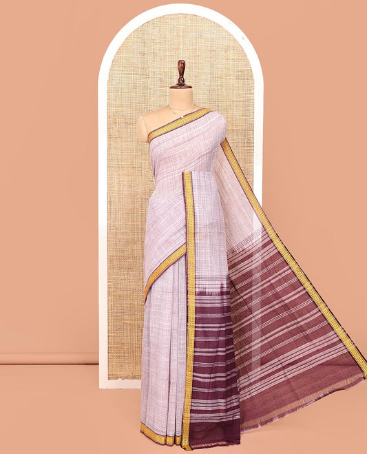 Pale Purple Andhra Cotton Saree, Sparsely Textured Heathered Patterns All Over Its Body, Complemented by Contrast Traditional Border, Pallu Steeped with Stripes, and Paired with a Matching Blouse