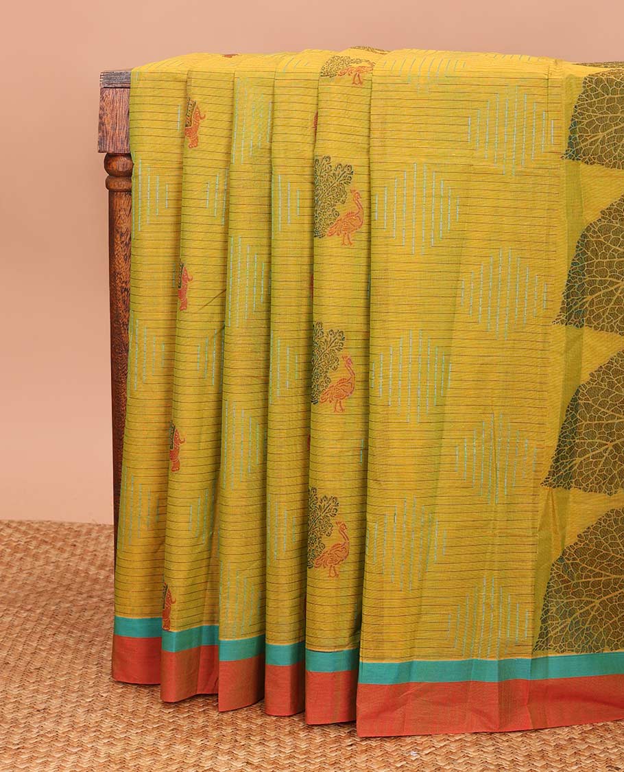 Green geometric and animal motifs printed Coimbatore cotton saree, contrast border, and pallu of elephant, peacock and leaf motifs