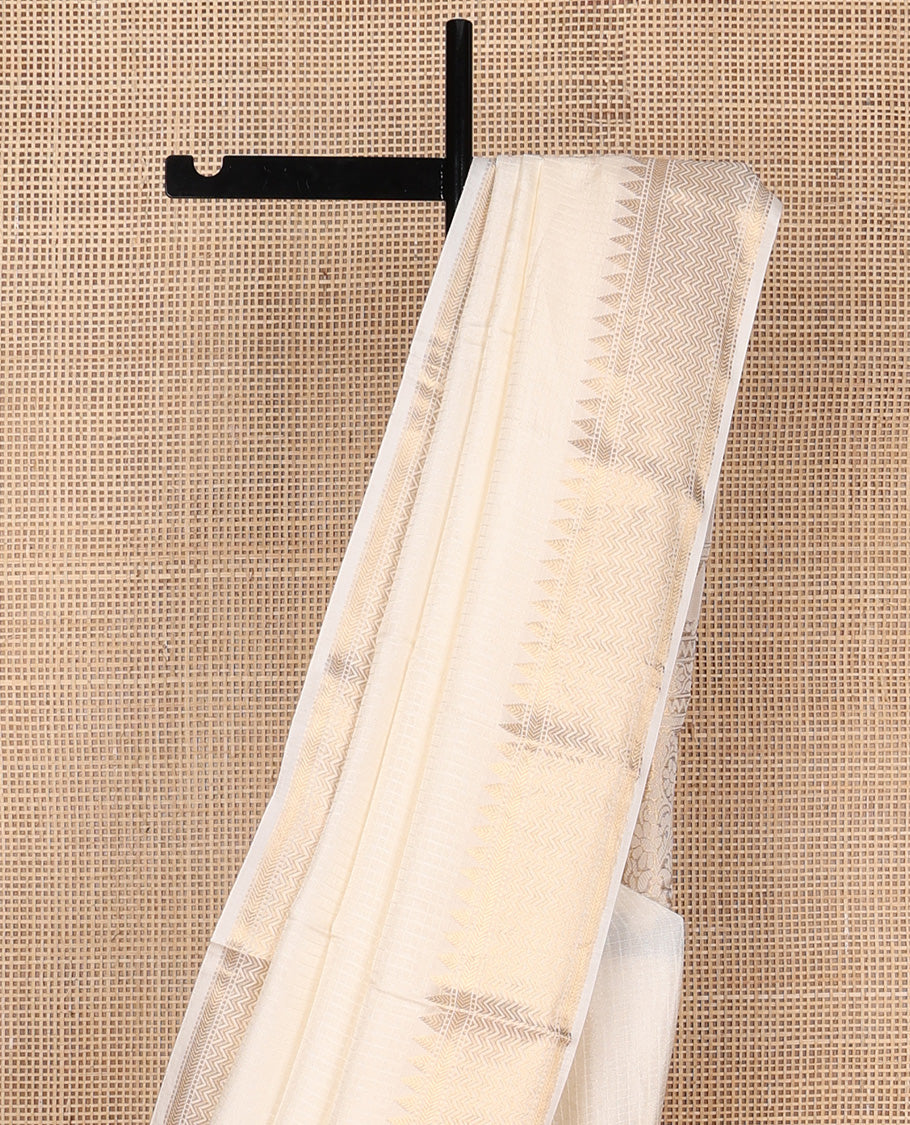 Dazzling white sparsely checked silk saree, traditional zari border, and traditional pallu of paisleys