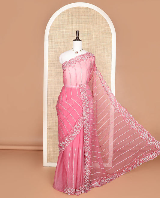 Pink vertically aligned Swarovski crystal stones embroidered designer saree, scallop thread woven flower stone work border