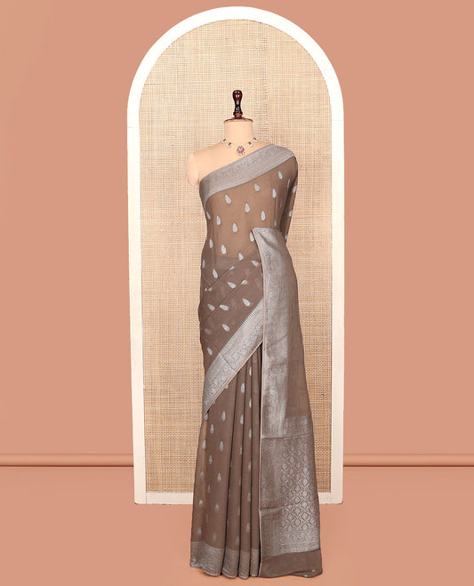 Brown Georgette Saree, Steeped with Buttas, Highlighted by a Traditional Floral Creeper Border, Intricately Designed Pallu, and  a Matching Blouse