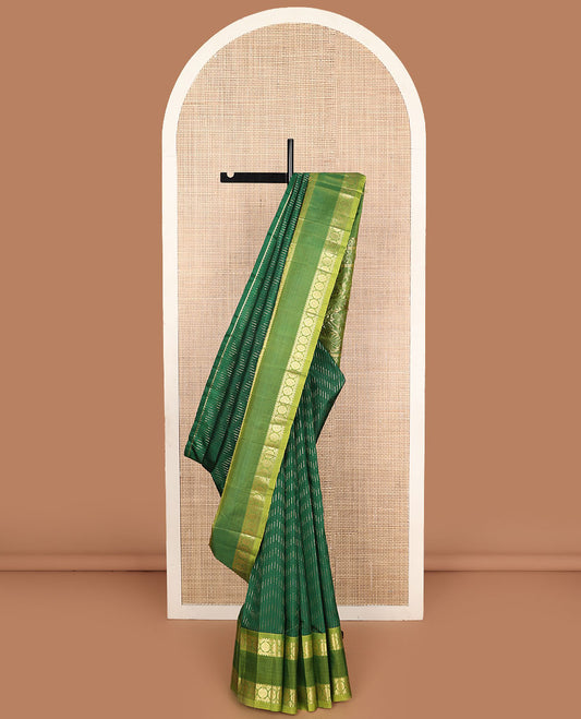 Green zari buttas Kanchipuram silk saree, contrast rettai pettu one-sided border of rekku, banaras, and chakram designs, and floral design pallu