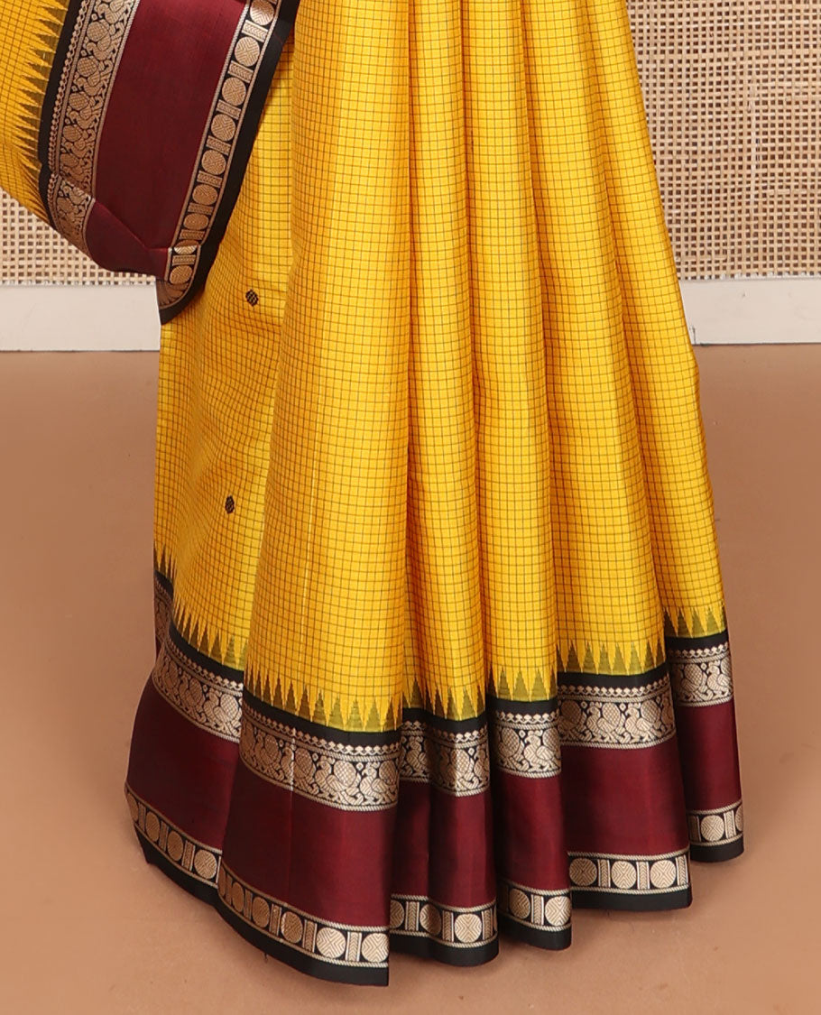 Yellow micro-checked & buttas kanchipuram silk saree, contrast rettai pettu border of salngai,banaras,mayil & rudraksham & seppu rekku pallu