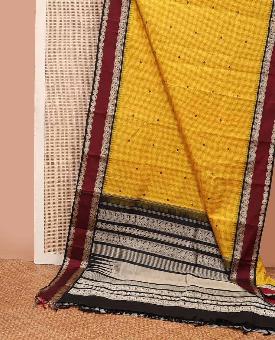 Yellow micro-checked & buttas kanchipuram silk saree, contrast rettai pettu border of salngai,banaras,mayil & rudraksham & seppu rekku pallu