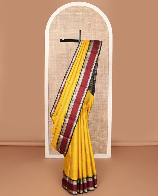 Yellow micro-checked & buttas kanchipuram silk saree, contrast rettai pettu border of salngai,banaras,mayil & rudraksham & seppu rekku pallu
