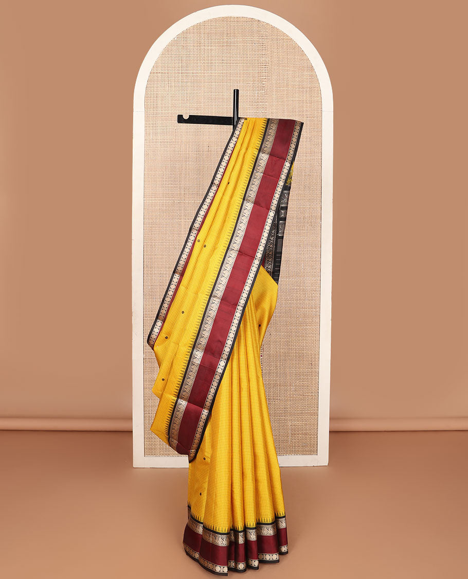Yellow micro-checked & buttas kanchipuram silk saree, contrast rettai pettu border of salngai,banaras,mayil & rudraksham & seppu rekku pallu
