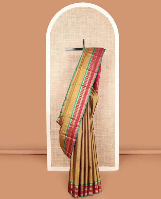 Mustard vazhaipoo striped Kanchipuram silk saree, contrast border and pallu of thilakam mokku, muthu, neli and rudraksham designs