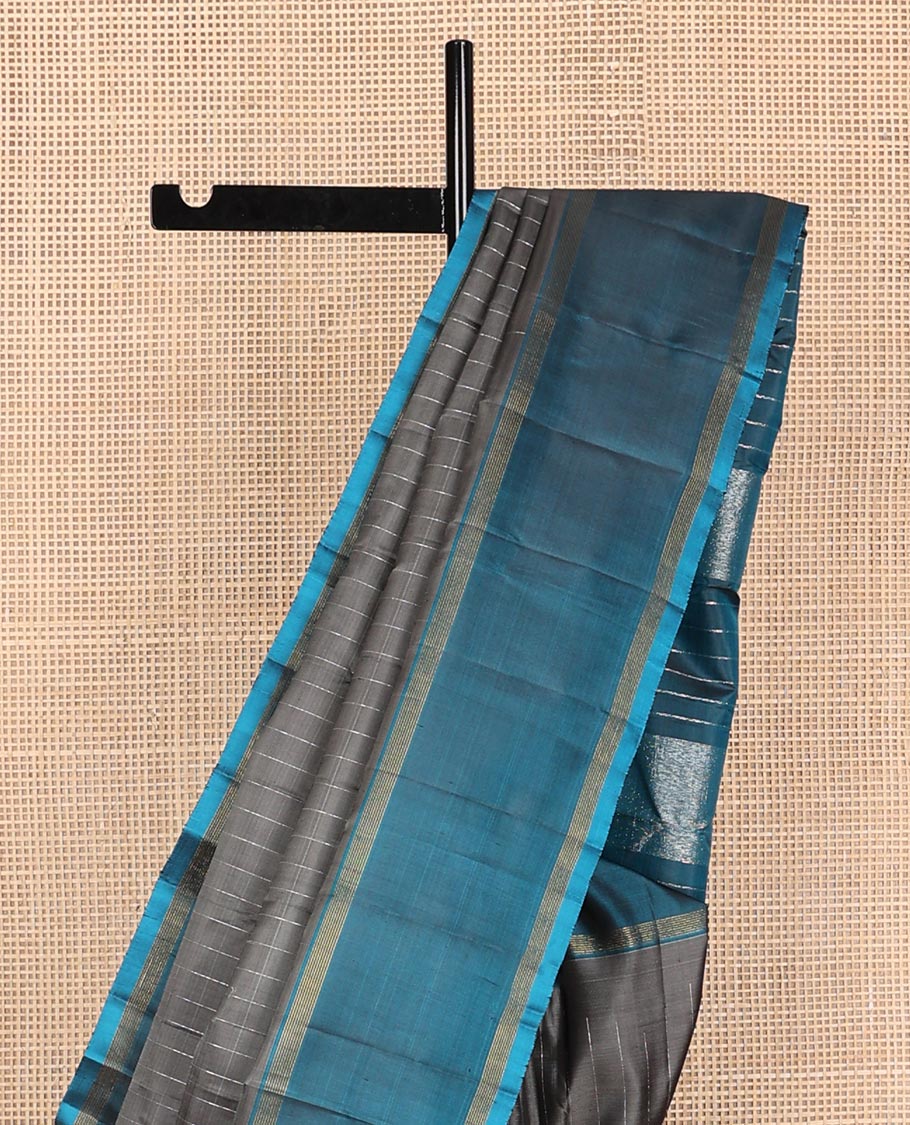 Dark grey striped Kanchipuram silk saree, contrast rettai pettu striped border, and temple zari pallu