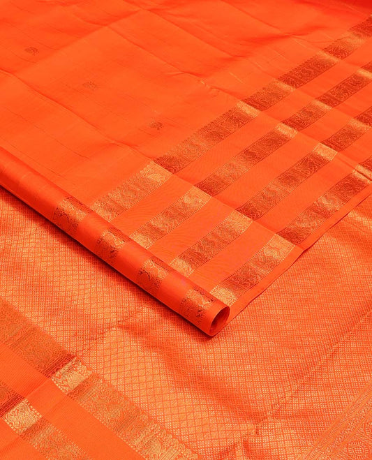 Orange zari buttas Kanchipuram silks saree, zari border of thilakam, muthu, yaanai, mayil, and kuthirai, and jaal pallu