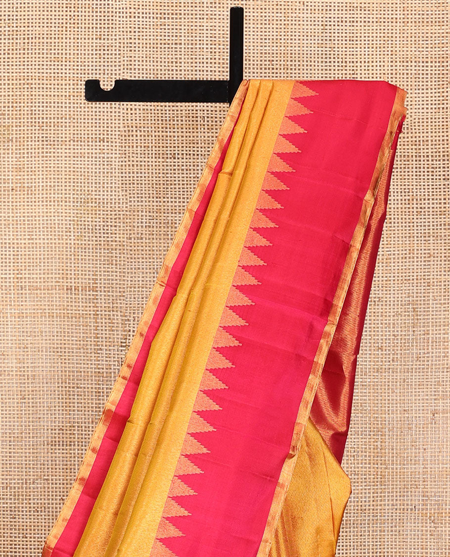Yellow zari woven Kanchipuram silk saree,  contrast thazampoo rekku zari border, and zari elevated pallu of pillaiyar mokku design