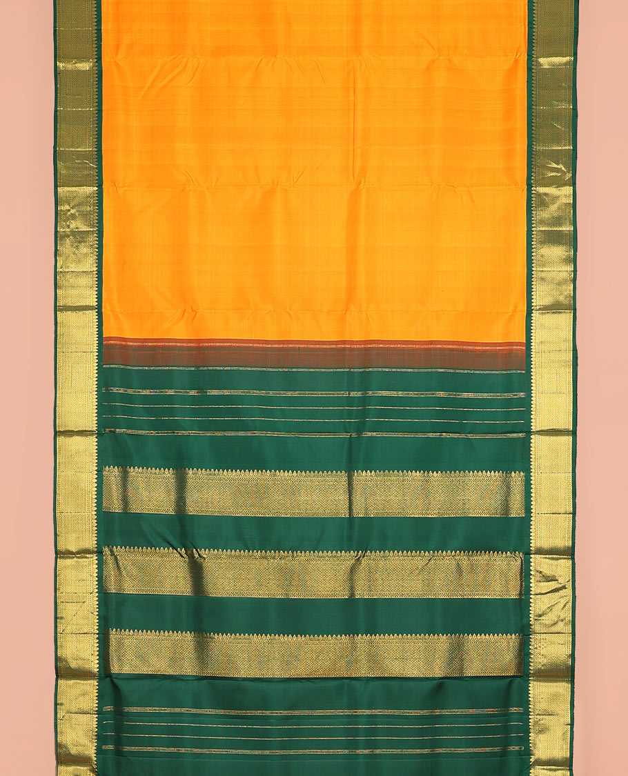 Orange plain nine-yard silk saree, contrast border of thilakam mokku, neli and paiyadi kattam designs, and pallu of zari designs