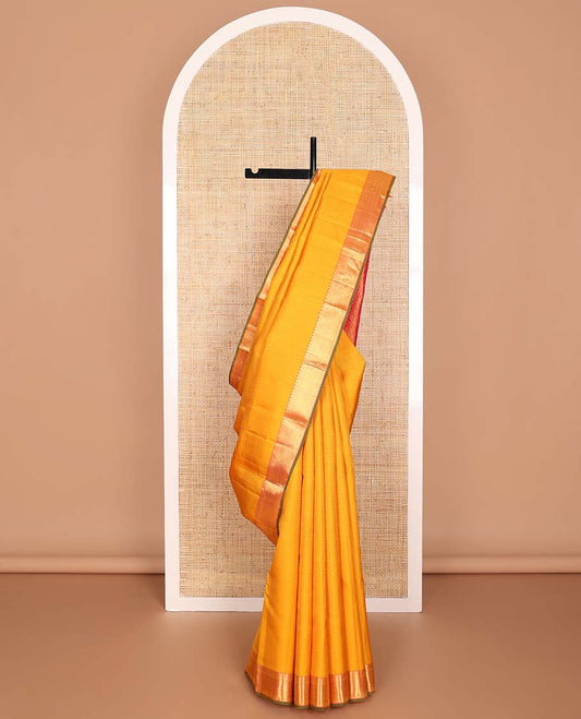 Orange  floral design silk saree with contrast border of thilakam mokku, paun, vanki design & floral pallu