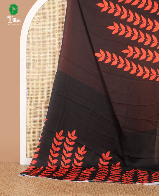 Borderless black half-half style crepe silk saree printed with orange color leaf vine design, leaf motifs printed blouse