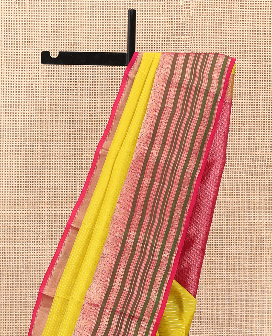 Yellow Vasundhara Silk Saree Adorned with Muthu Stripes All Over Its Body, Contrast Border of Thilakam Mokku, Muthu, Banaras, Mayil, Kamalam, and Neli Designs, Intricate Pallu, and Paired with a Contrast Blouse
