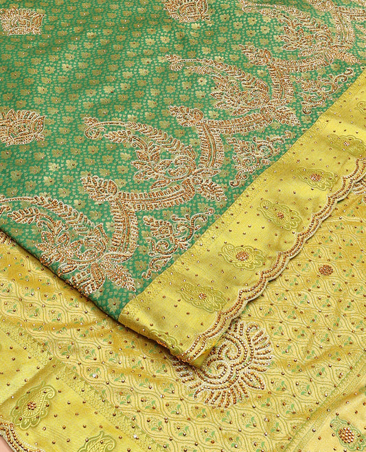 Green jacquard stone embroidered silk saree, contrast scallop cut embroidered zari border & ogee patterned & embroidered pallu