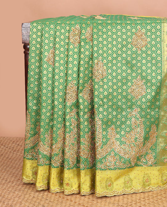 Green jacquard stone embroidered silk saree, contrast scallop cut embroidered zari border & ogee patterned & embroidered pallu