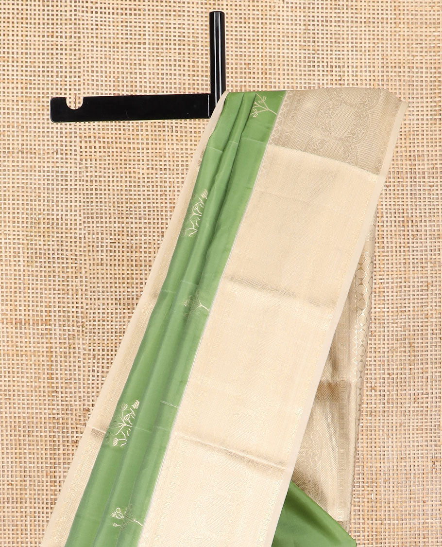 Green buttas vasundhara elite silk saree with contrast floral design border & intricate zari design pallu