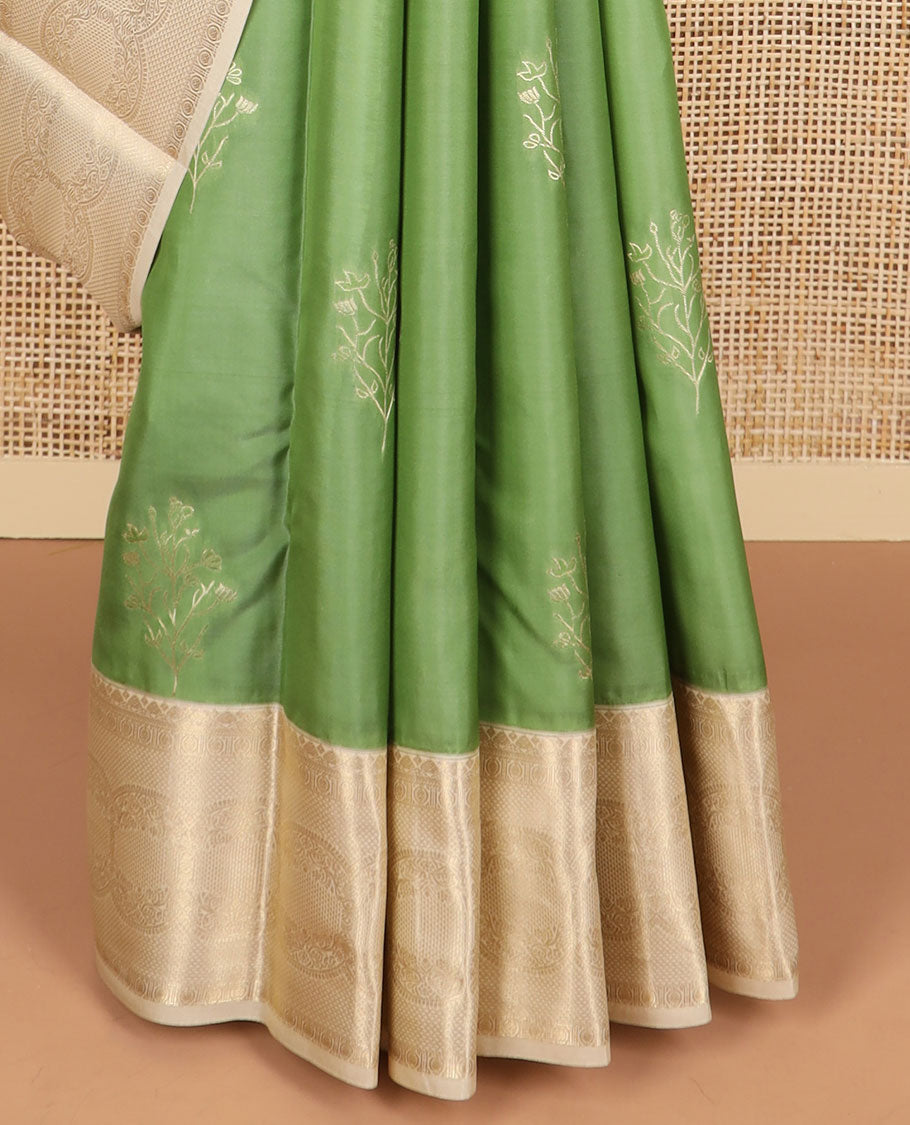 Green buttas vasundhara elite silk saree with contrast floral design border & intricate zari design pallu